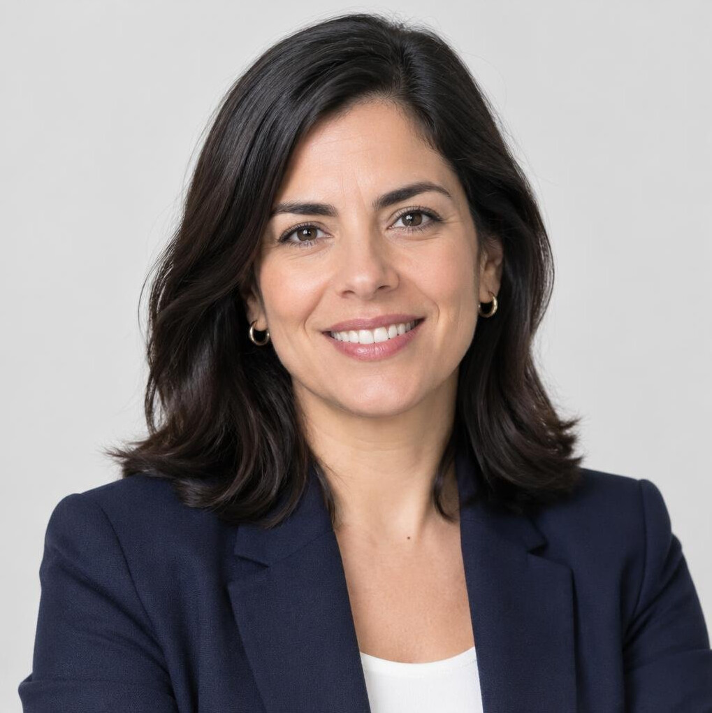 Portrait of a smiling Latina woman in a blazer