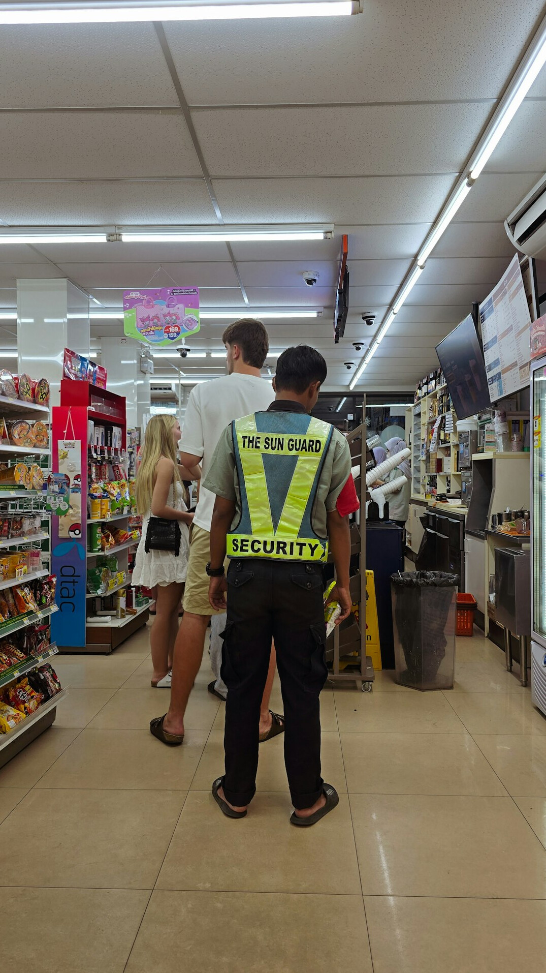 store detective watching shoppers